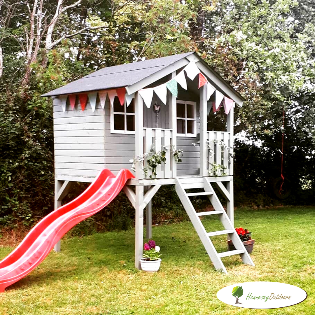 wooden playhouse on stilts