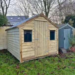 10ft x 8ft Timber Garden Shed in a garden next to a smaller shed